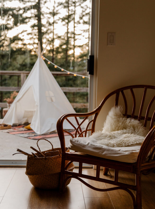 accent chair and kid's tee pee outside